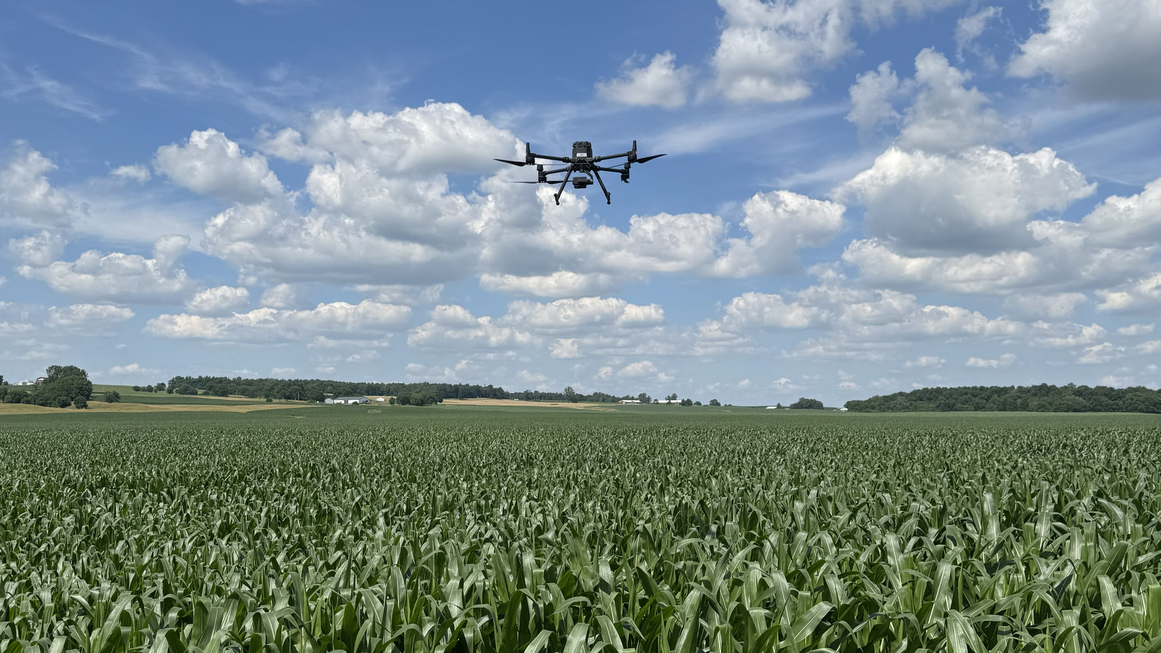 An AcreWatch drone resting in a dock-based station between scheduled flights